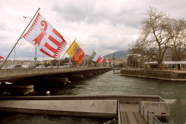 Flags of all the Swiss cantons on a bridge in Geneva